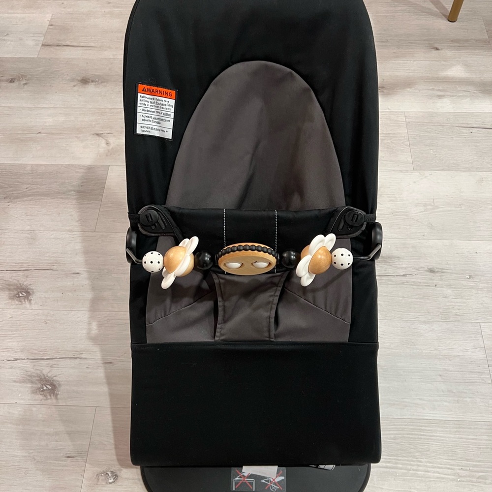 Black and Gray Baby Bjorn Bouncer with Toy Bar